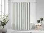 Green striped shower curtain styled in a minimalist bathroom with natural accents, showcasing a timeless farmhouse stripe pattern for cottagecore and heritage-inspired decor.