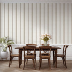 Neutral stripe wallpaper in linen and tobacco styled in a dining space, emphasizing cottagecore, farmhouse, and French country decor.