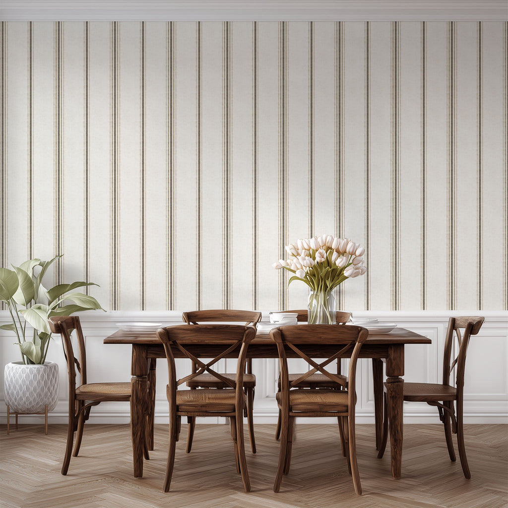 Neutral stripe wallpaper in linen and tobacco styled in a dining space, emphasizing cottagecore, farmhouse, and French country decor.