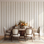French country stripe wallpaper in Linen and Tobacco tones styled in a dining room, featuring a timeless vertical stripe pattern for neutral interiors.