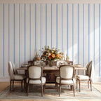 French country stripe wallpaper in Chalk and French Blue tones styled in a dining room, featuring a timeless vertical stripe pattern for neutral interiors.