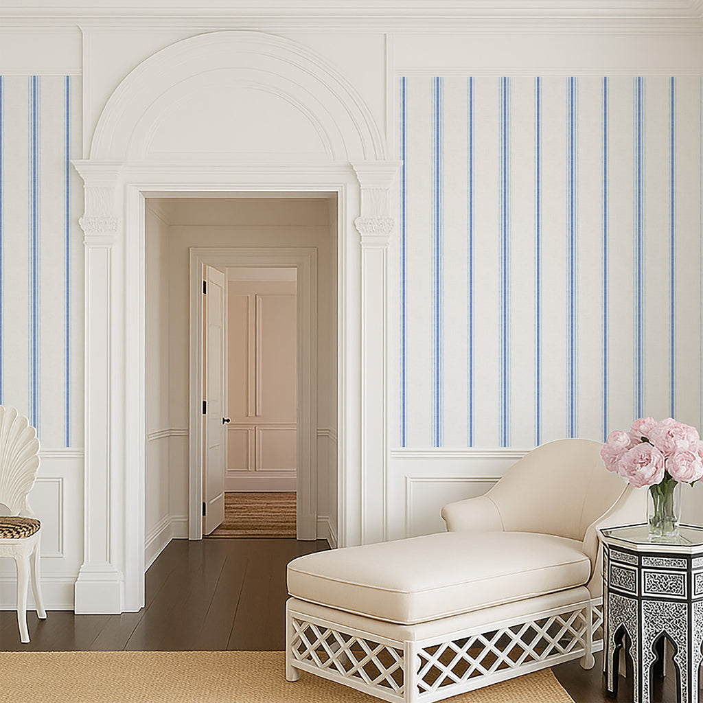 Chalk and French Blue stripe wallpaper styled in an elegant hallway with arched architecture, highlighting classic French country and timeless interior design.