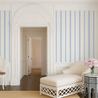 Chalk and French Blue stripe wallpaper styled in an elegant hallway with arched architecture, highlighting classic French country and timeless interior design.