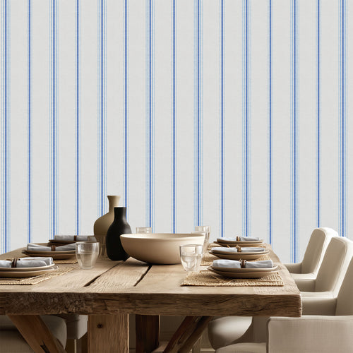 Chalk and French Blue stripe wallpaper styled in a dining room with wood table and neutral decor, showcasing French country and modern farmhouse interiors.