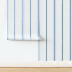 Laurent Stripe wallpaper in Chalk and French Blue shown in a tiled panel layout, illustrating the vertical stripe pattern and repeat for installation.