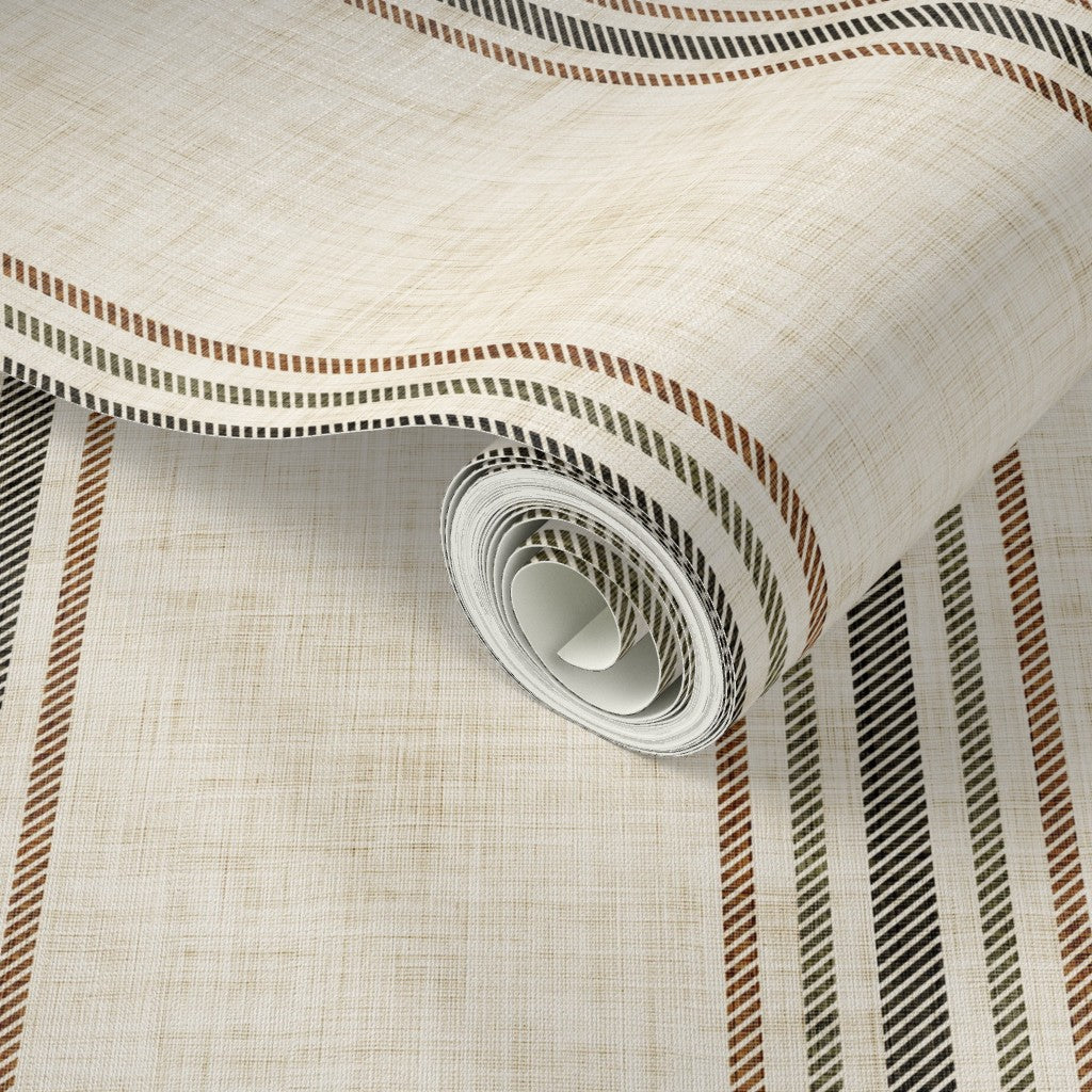 Close-up of parchment and olive stripe wallpaper roll showing textured linen-style background and classic vertical stripe detail.