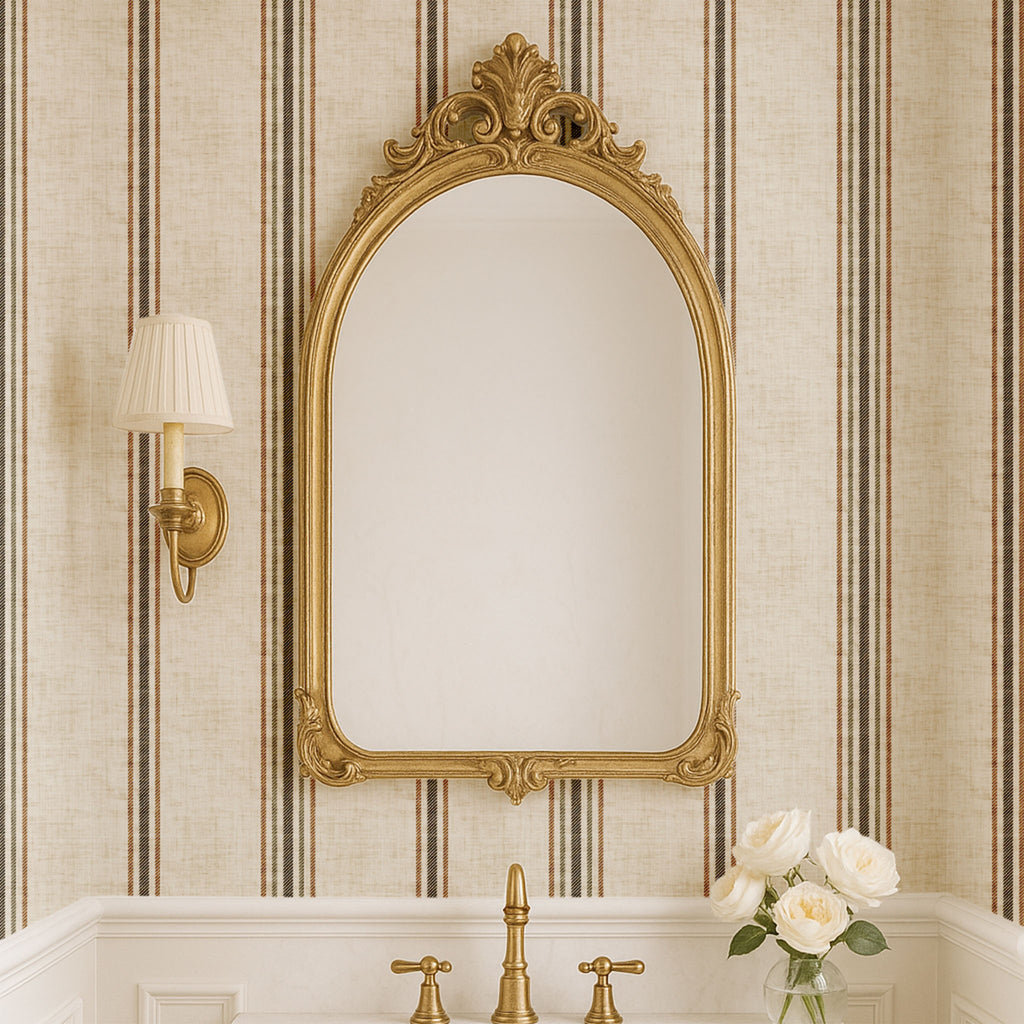 Parchment and olive stripe wallpaper styled behind an ornate mirror in a bathroom, showcasing elegant French country and heritage interior styling.
