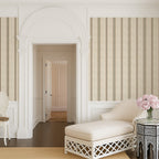 Parchment and olive stripe wallpaper styled in an elegant hallway with arched architecture, highlighting classic French country and timeless interior design.