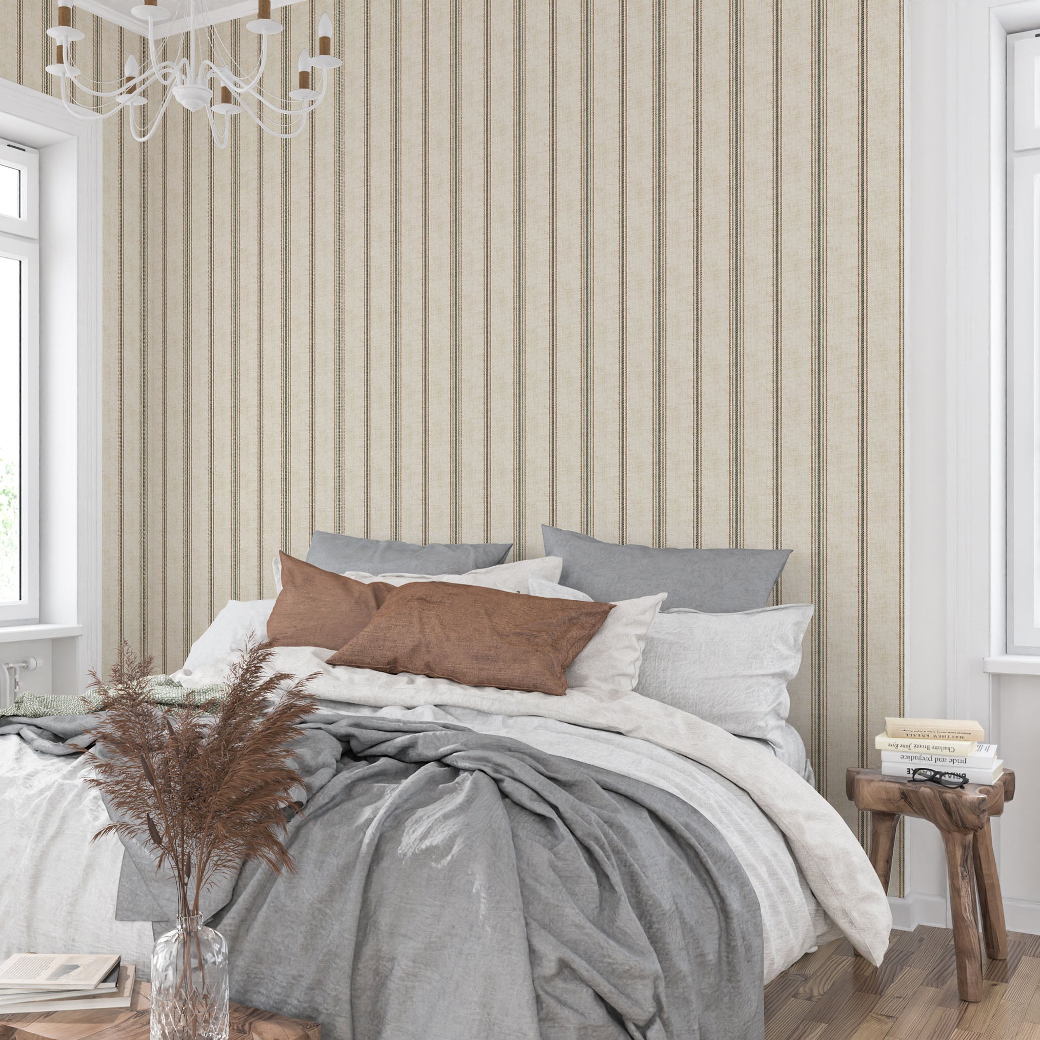 Neutral stripe wallpaper in parchment and olive tones behind a bed, creating a calm French country bedroom with cottagecore and heritage-inspired decor.