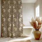 William Morris shower curtain in neutral beige and cream tones in a boho-stle bathroom with warm light