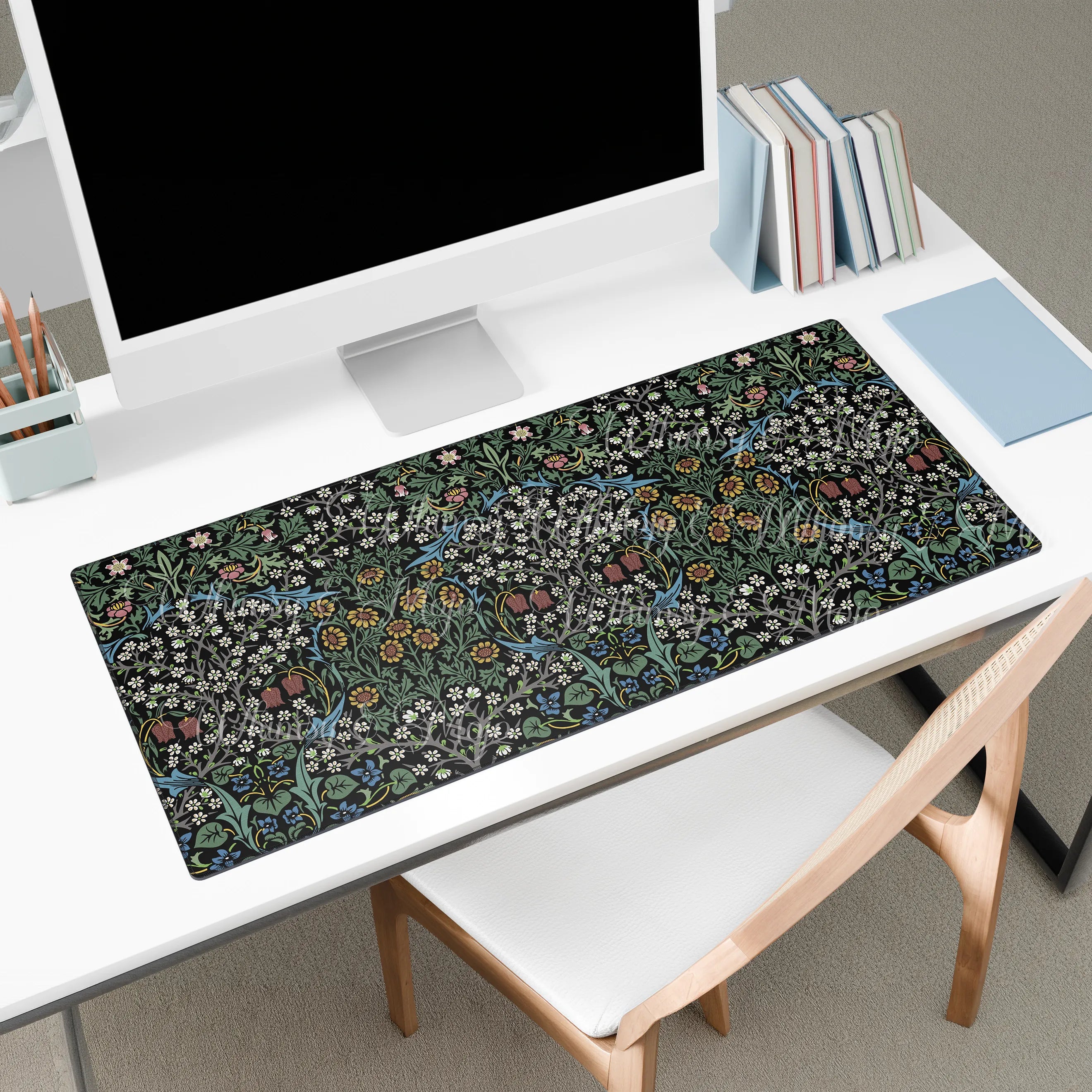 William Morris Blackthorn desk mat styled on a workspace with keyboard and accessories, showcasing a classic Arts and Crafts botanical pattern for elegant home office decor.
