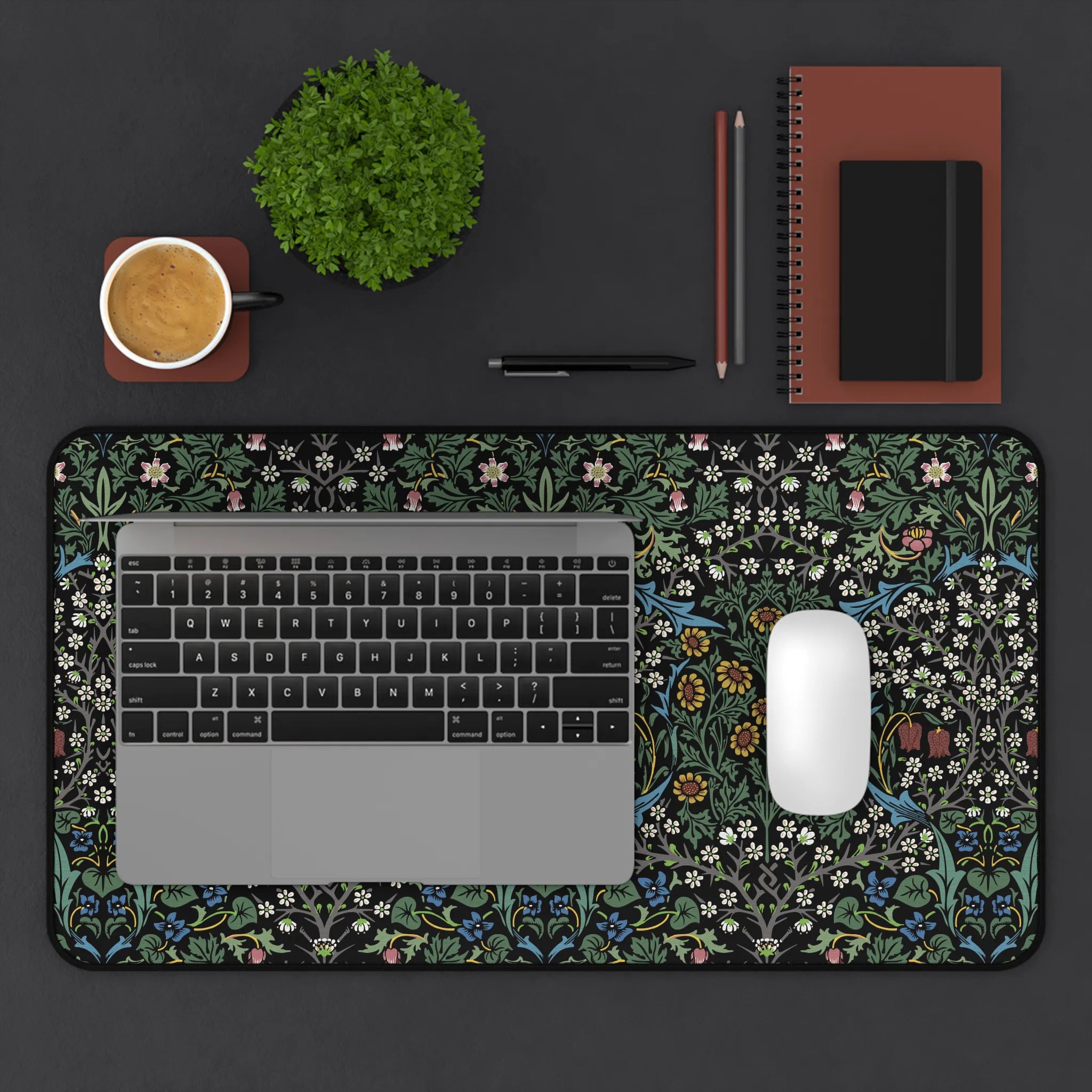 Blackthorn desk mat inspired by William Morris featuring flowing vines and floral motifs, adding heritage revival style to a modern home office setup.