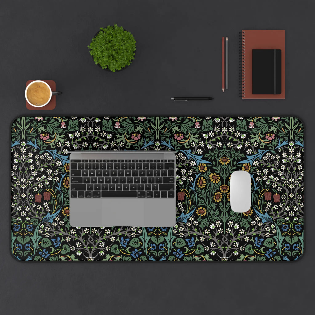 William Morris Blackthorn desk mat styled on a workspace with keyboard and accessories, showcasing a classic Arts and Crafts botanical pattern for elegant home office decor.