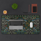 William Morris Blackthorn desk mat styled on a workspace with keyboard and accessories, showcasing a classic Arts and Crafts botanical pattern for elegant home office decor.