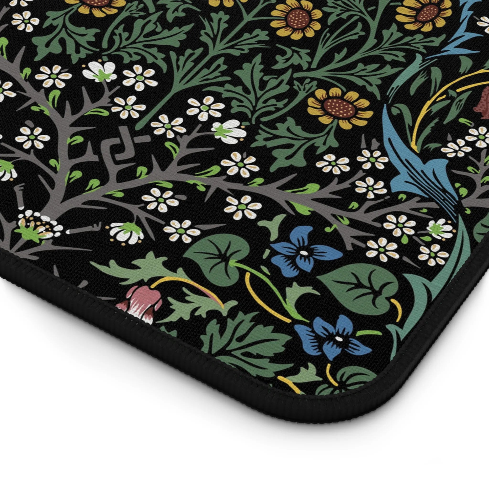 closeup of William Morris desk mat in dramatic Blackthorn