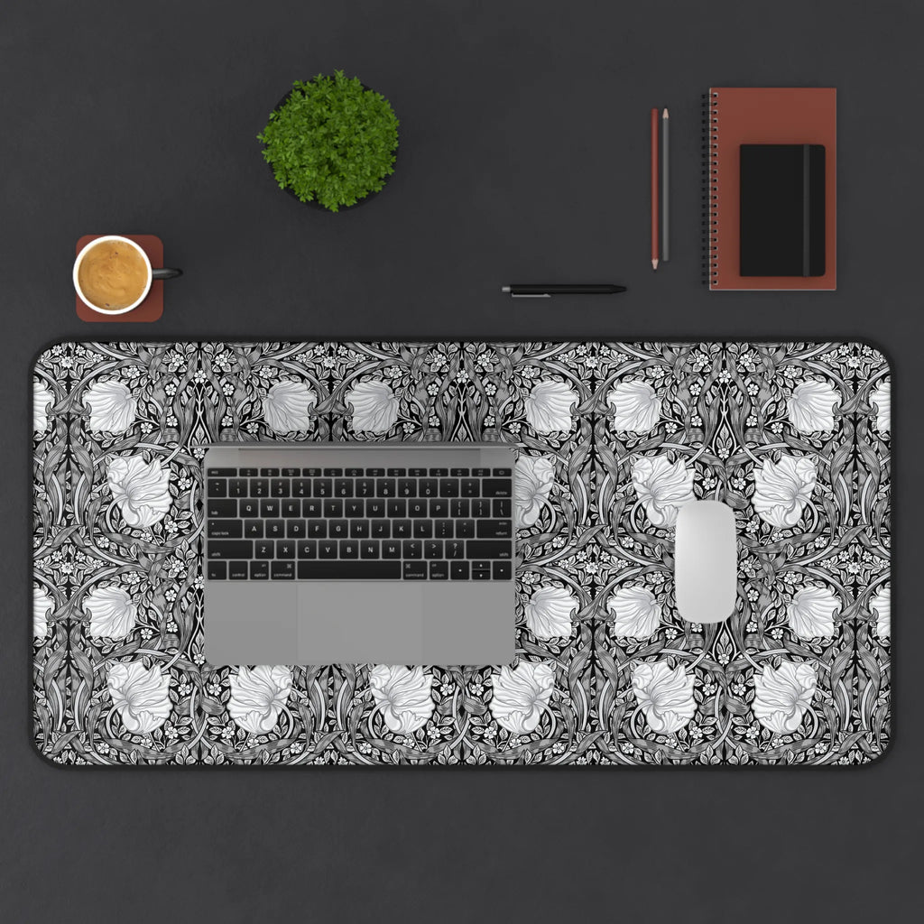 Decorative William Morris Pimpernel desk mat with floral pattern, keyboard, cup, plant, and stationery items on a dark surface.