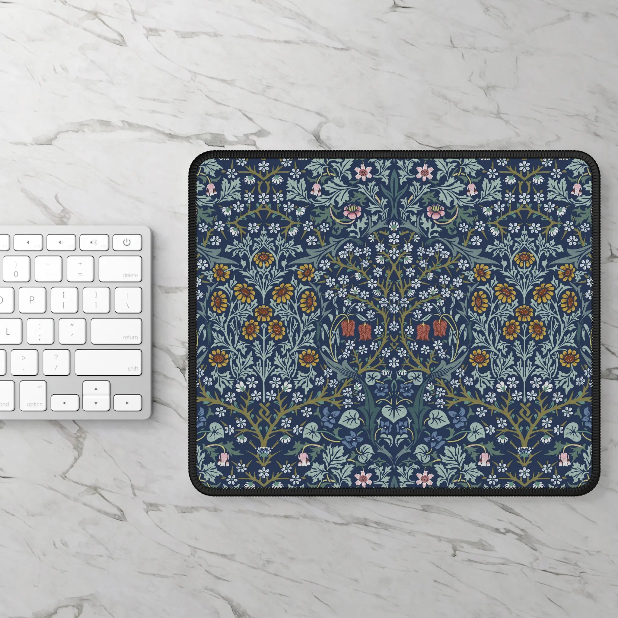William Morris Blackthorn mousepad styled with a laptop and accessories, showcasing a timeless Arts and Crafts floral design for elegant workspace decor.