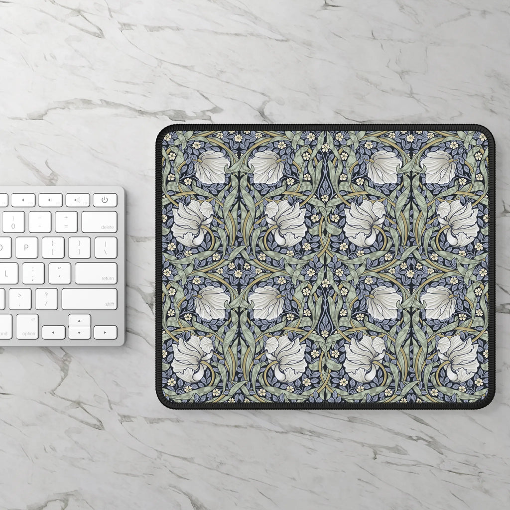 Floral patterned William Morris mouse pad on a marble surface with a keyboard.