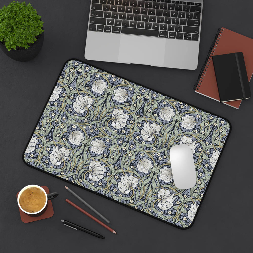William Morris desk pad with Pimpernel pattern on a desk with laptop, notebook, and coffee cup.