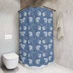 Bathroom with a blue William Morris Pimpernel floral-patterned shower curtain and a white toilet.