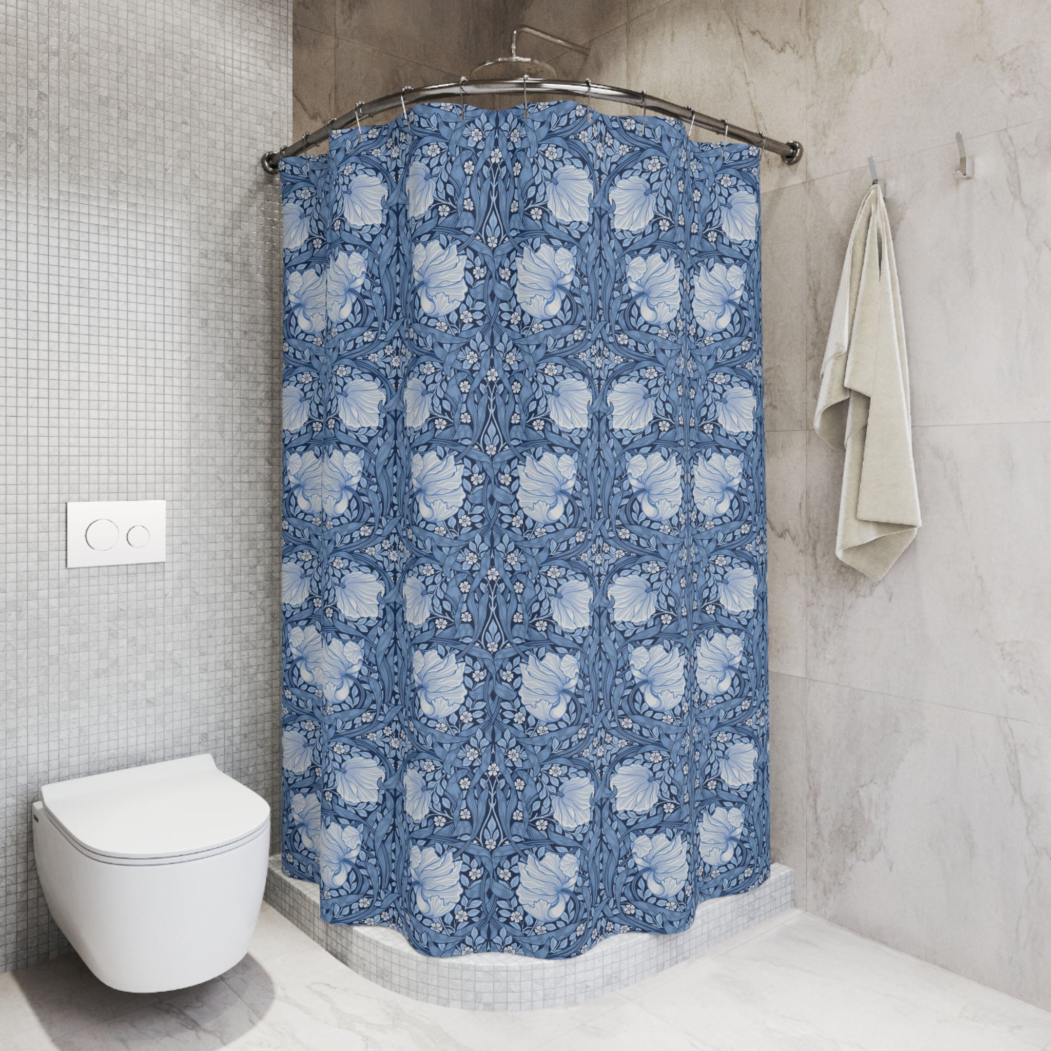 Bathroom with a blue William Morris Pimpernel floral-patterned shower curtain and a white toilet.