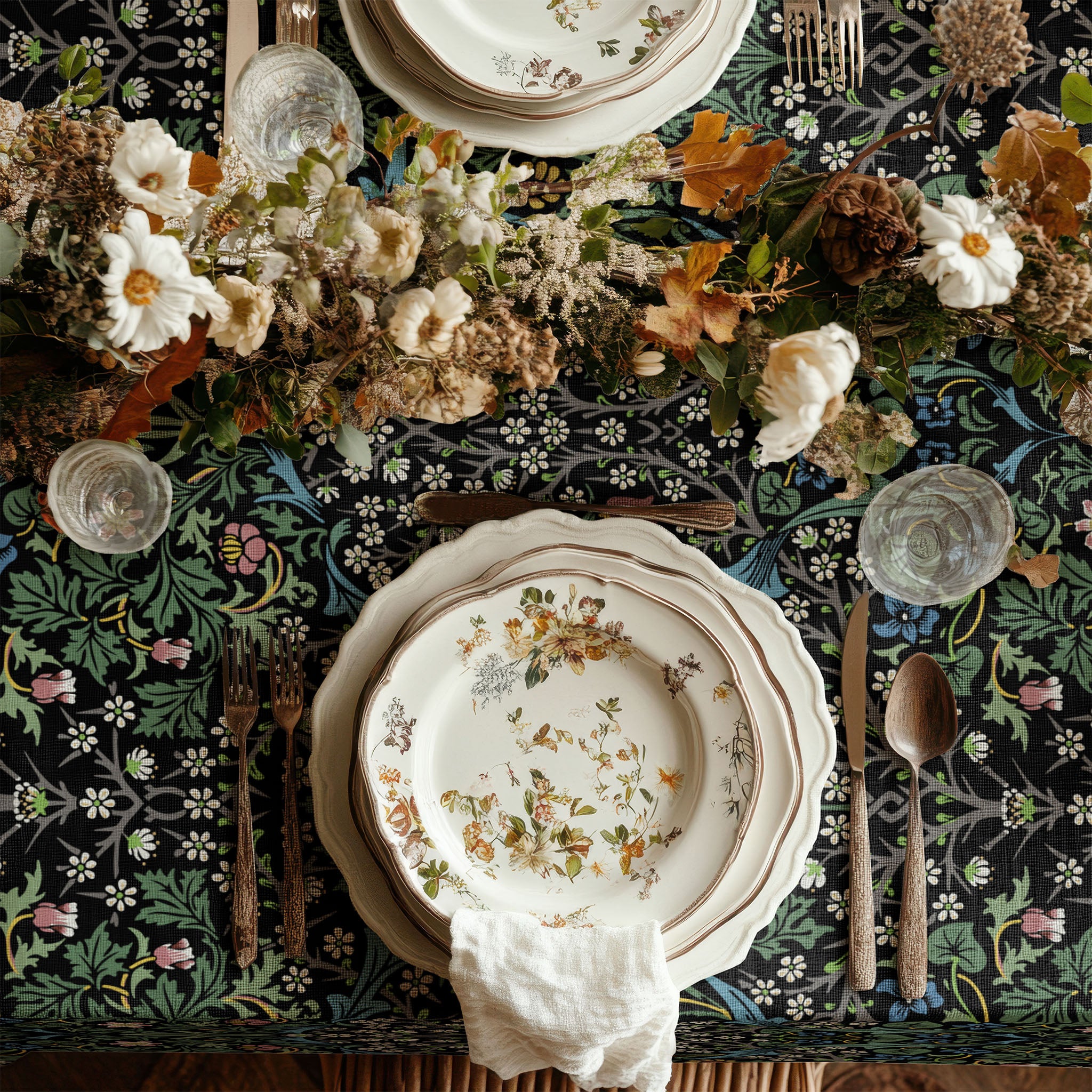 William Morris Blackthorn tablecloth in Dramatic Black featuring an intricate Arts and Crafts botanical pattern, styled for heritage revival dining tables and English country decor.