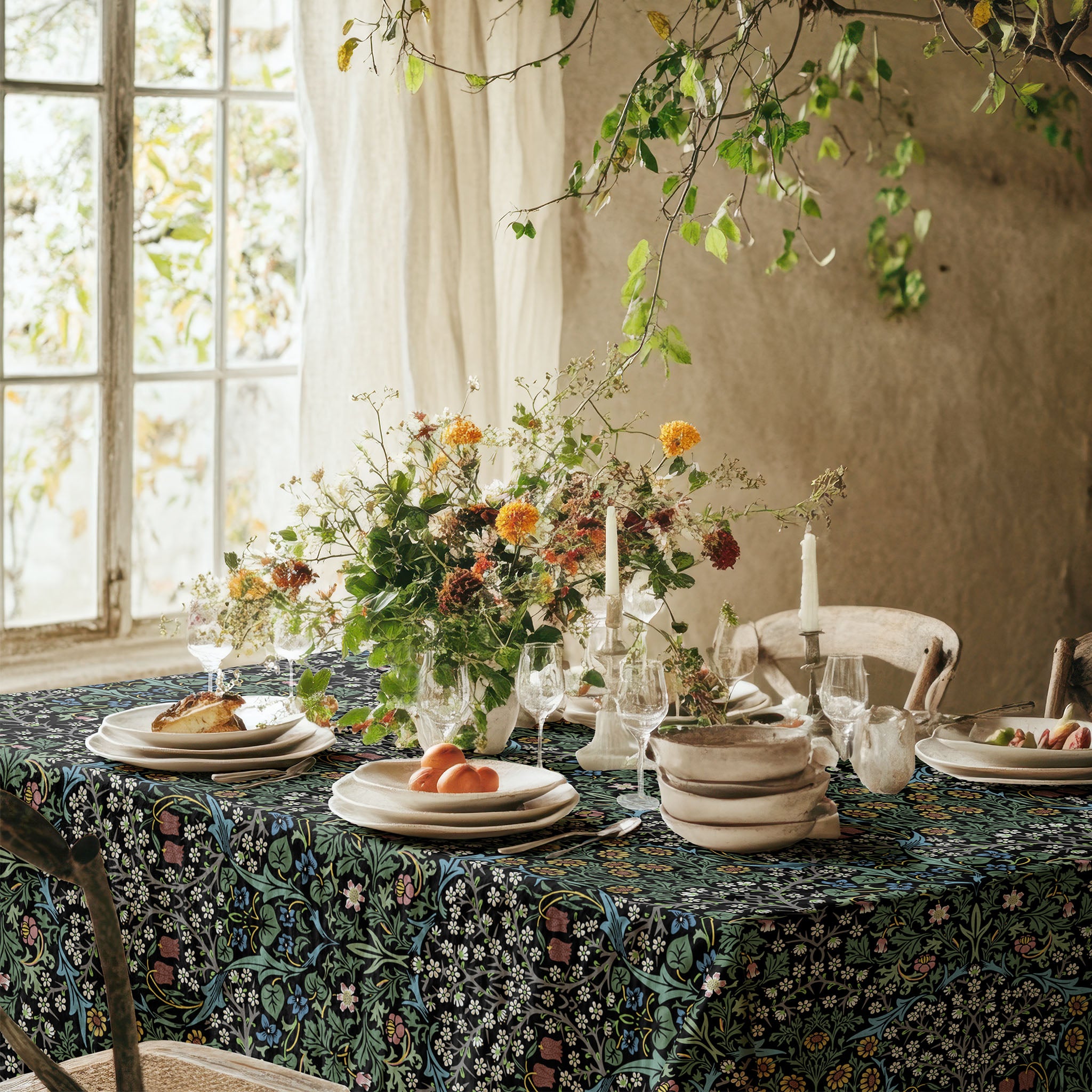 Blackthorn tablecloth by William Morris in a Dramatic Black colorway featuring classic botanical design, ideal for heritage interiors and vintage-inspired table settings.