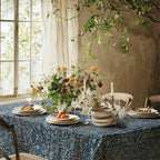 William Morris Blackthorn tablecloth in blue with intricate vines and floral motifs, styled for cottagecore tablescapes and English country dining rooms.