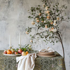 William Morris Blackthorn tablecloth in olive green with intricate vines and floral motifs, styled for cottagecore tablescapes and English country dining rooms.