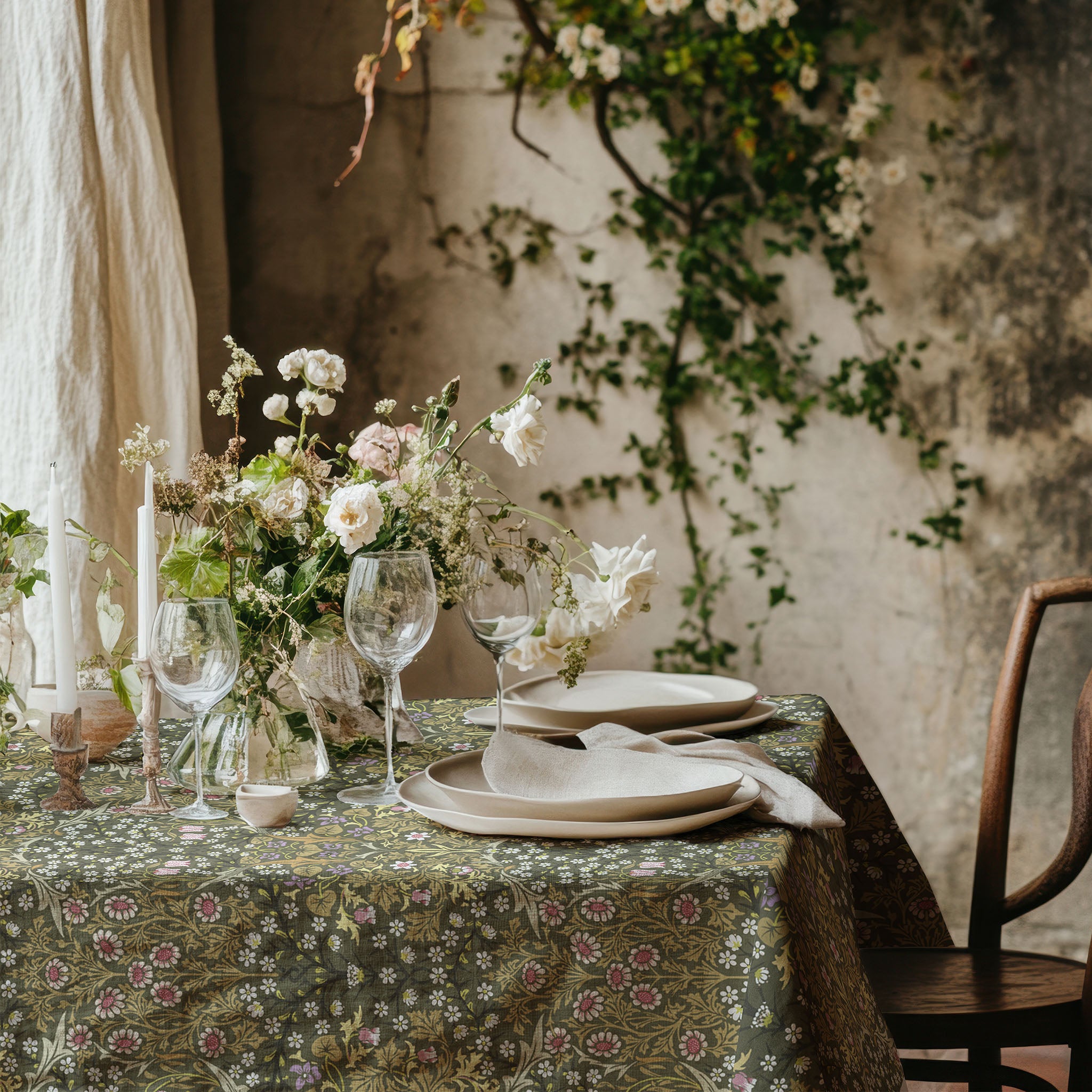 William Morris Blackthorn tablecloth in olive green with intricate vines and floral motifs, styled for cottagecore tablescapes and English country dining rooms.
