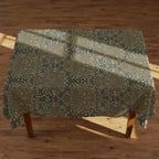 William Morris Blackthorn tablecloth in olive green with intricate vines and floral motifs, styled for farmhouse tablescapes and English country dining rooms.