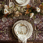 William Morris tablecloth in maroon Blackthorn featuring an intricate Arts and Crafts botanical pattern, styled for heritage revival dining tables and English country decor.