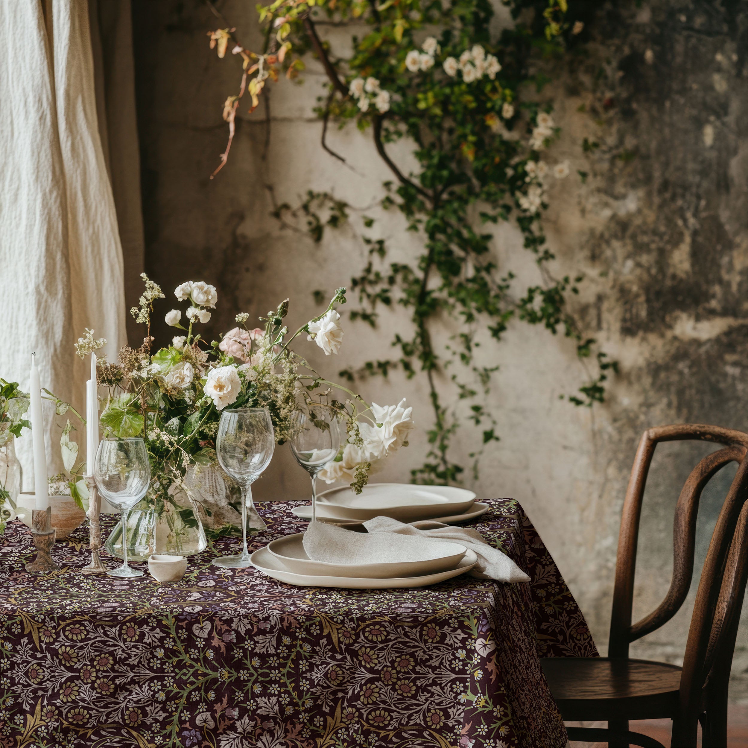 Blackthorn tablecloth by William Morris in a rich maroon colorway featuring classic botanical design, ideal for heritage interiors and vintage-inspired table settings.