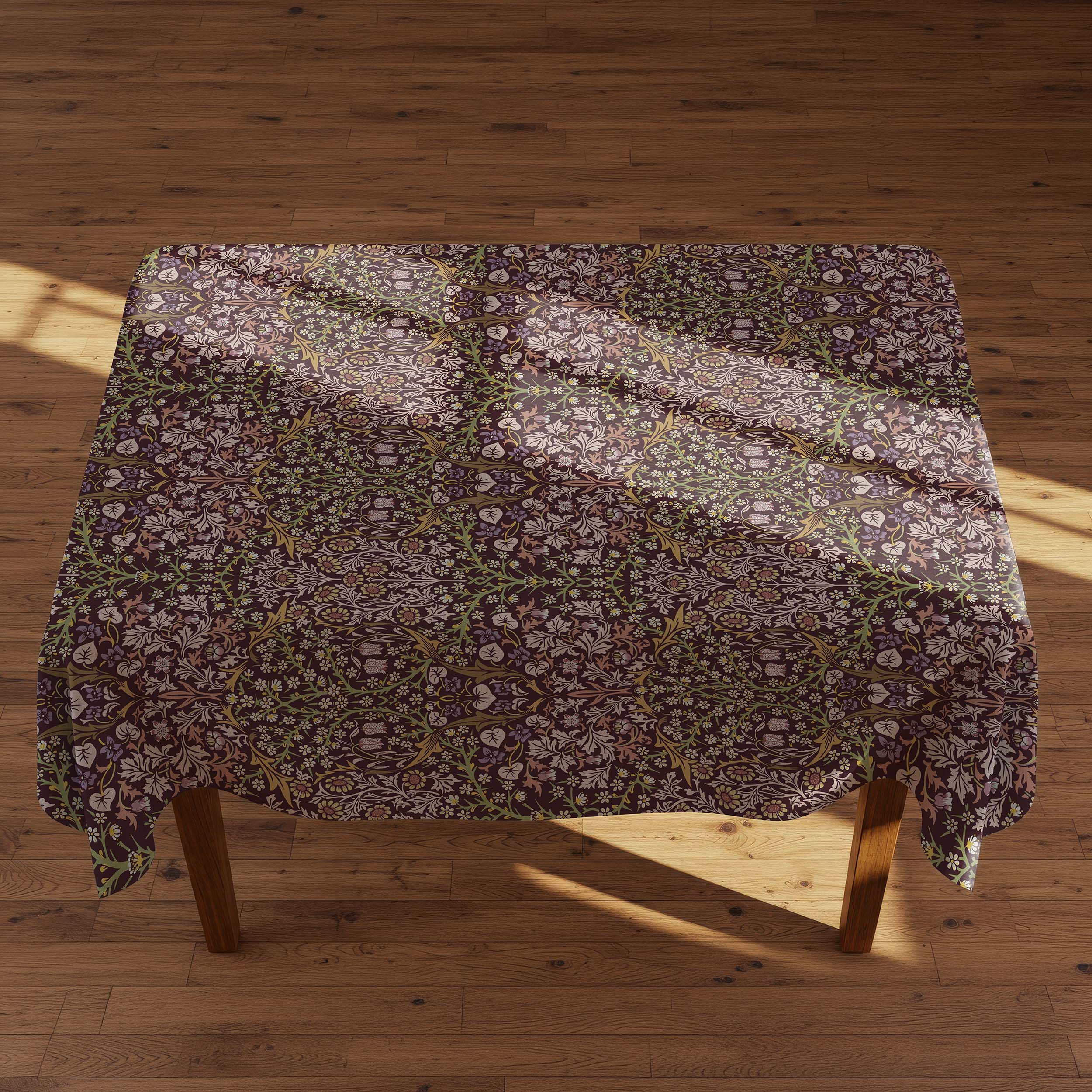Blackthorn tablecloth by William Morris in a rich maroon colorway featuring classic botanical design, ideal for heritage interiors and vintage-inspired table settings.