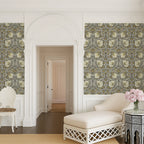 William Morris Pimpernel wallpaper in Heritage Greige and Ochre styled in an elegant hallway with arched doorway.