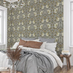 Bedroom styled with William Morris Pimpernel wallpaper in Heritage Greige and Ochre behind the bed.