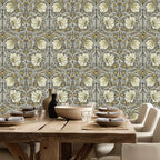 Dining room with wooden table and William Morris Pimpernel wallpaper in Heritage Greige and Ochre.