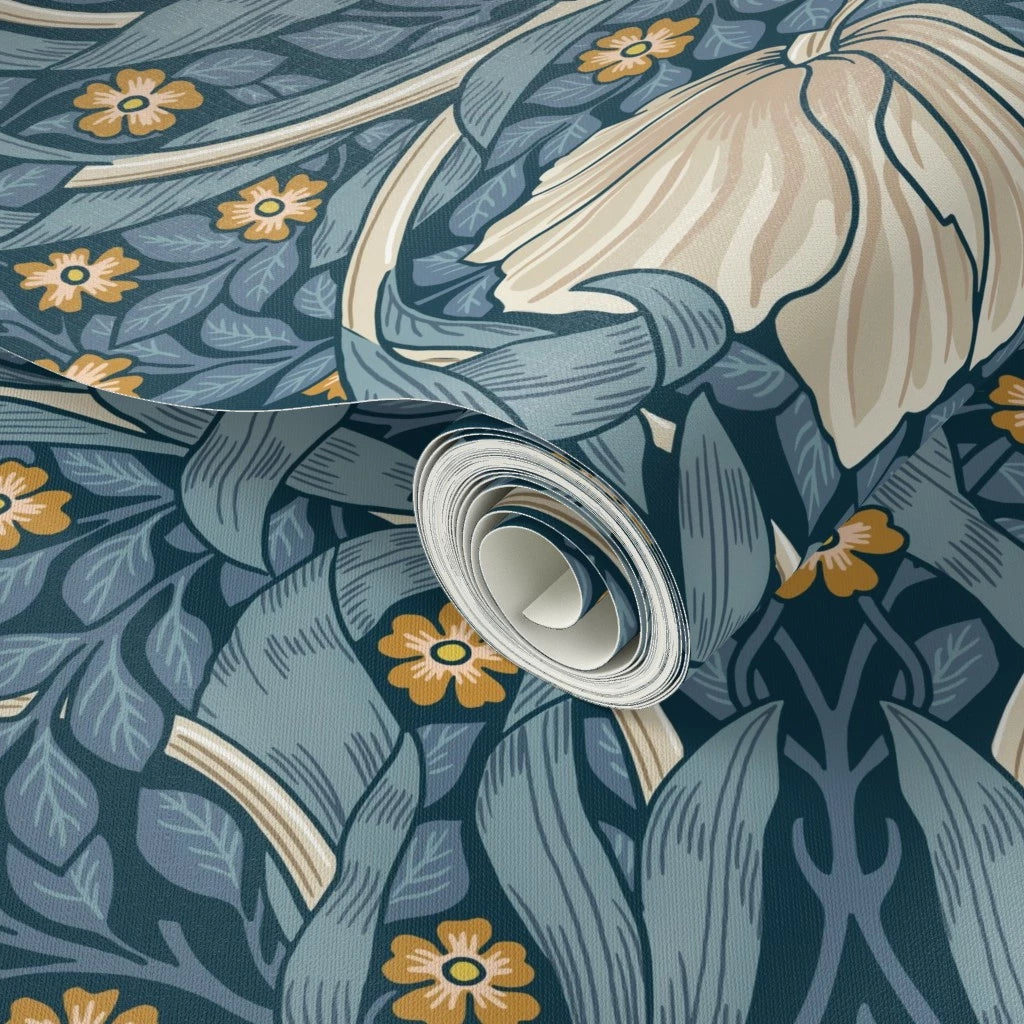 Close-up of a roll of wallpaper with floral William Morris wallpaper.