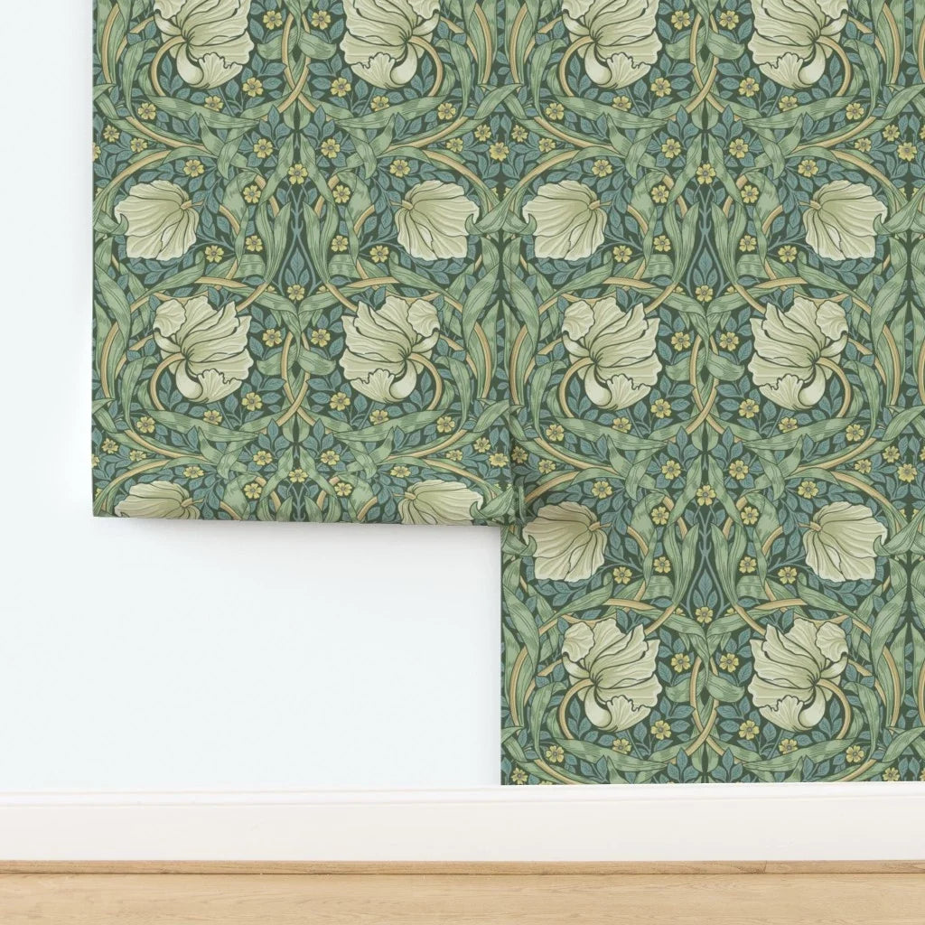 Close-up detail of William Morris Pimpernel wallpaper in Heritage Green, showing fine linework and layered botanical motifs.