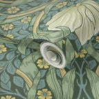 Roll of William Morris Pimpernel wallpaper in Heritage Green, highlighting the repeat pattern and texture.