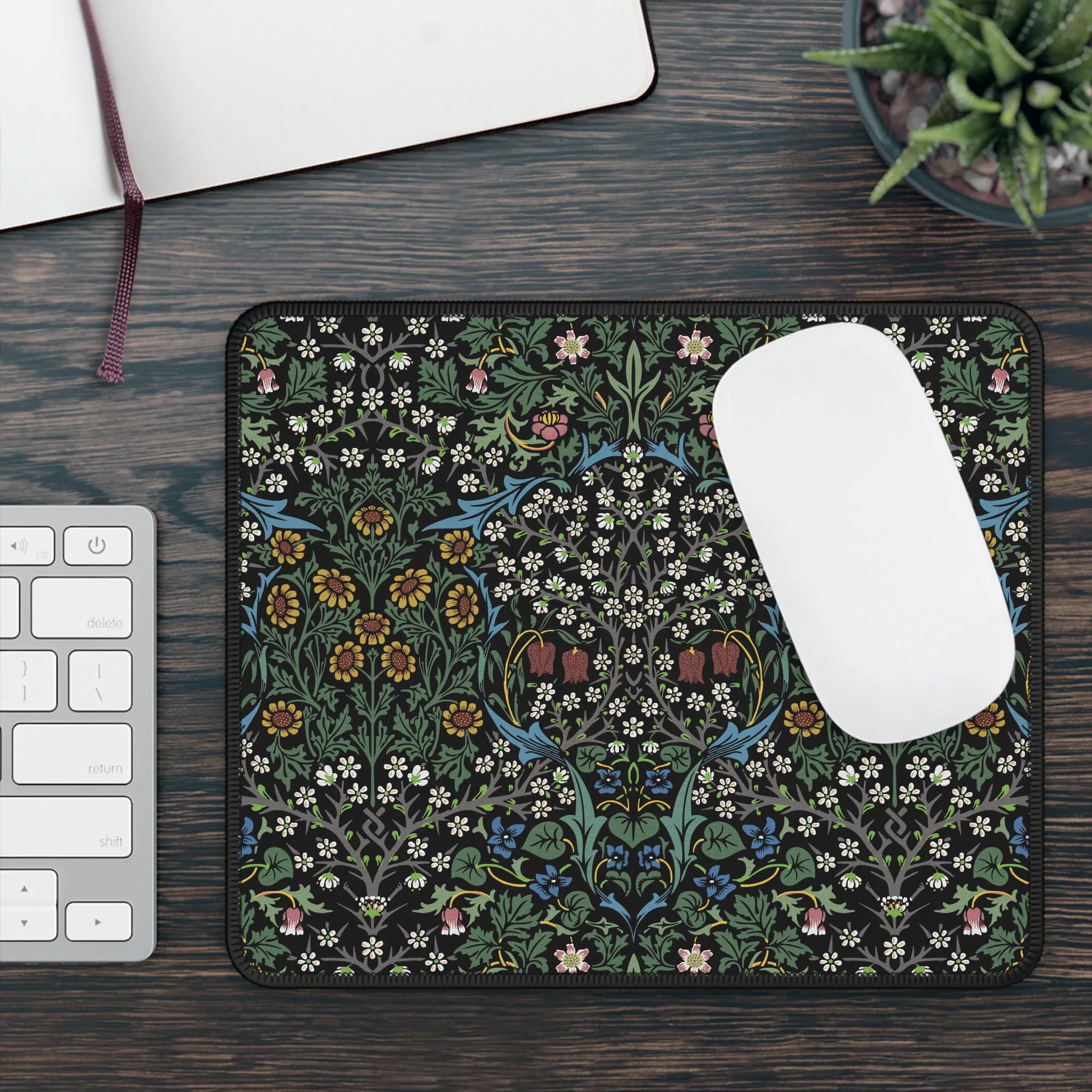 William Morris mousepad in Blackthorn, styled with a laptop and accessories, showcasing a timeless Arts and Crafts floral design for elegant workspace decor.