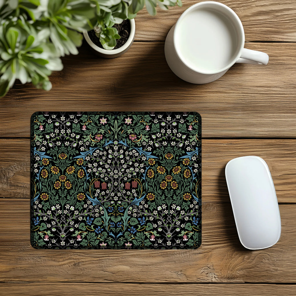 William Morris mousepad in Blackthorn, styled with a mouse and a cup of coffee, showcasing a timeless Arts and Crafts floral design for elegant workspace decor.