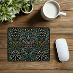 William Morris mousepad in Blackthorn, styled with a mouse and a cup of coffee, showcasing a timeless Arts and Crafts floral design for elegant workspace decor.