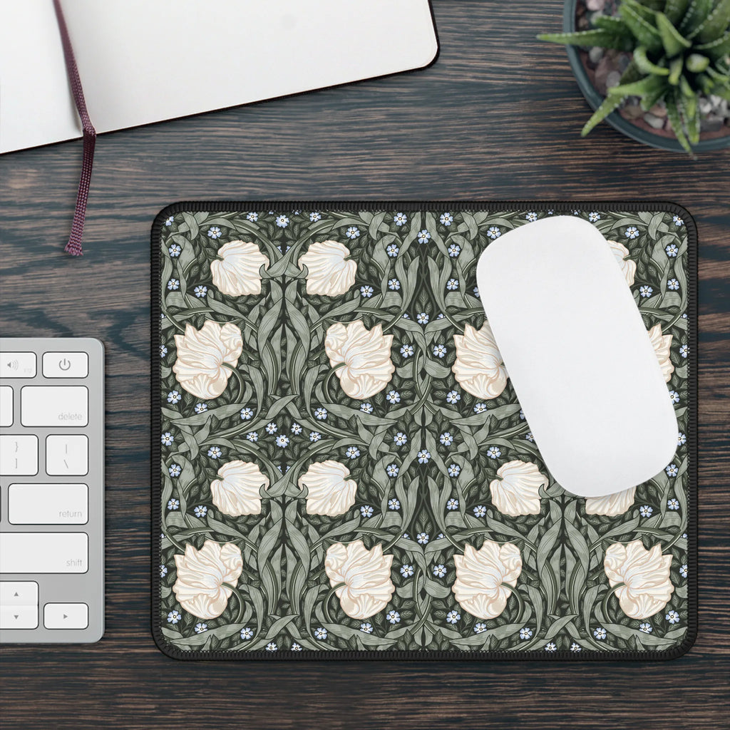 Decorative William Morris mouse pad with floral pattern on a desk with keyboard and mouse.