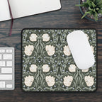 Decorative William Morris mouse pad with floral pattern on a desk with keyboard and mouse.