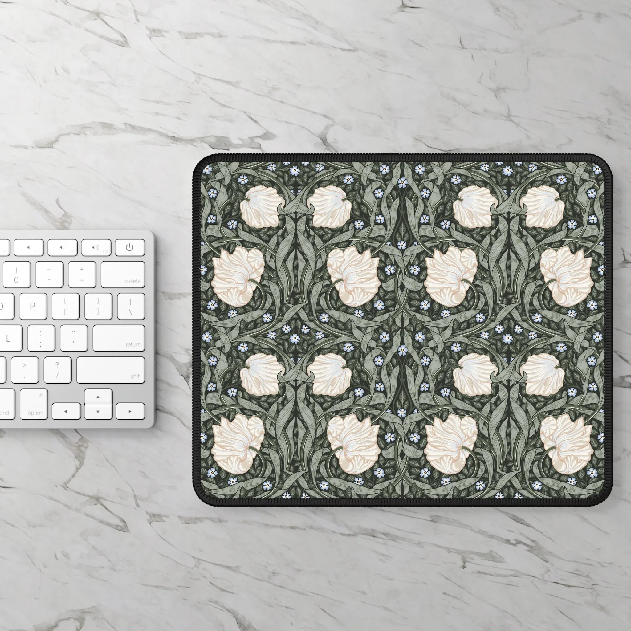 Pimpernel by William Morris mouse pad on a marble surface with a keyboard