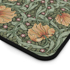 Floral patterned William Morris Pimpernel mouse pad with orange flowers and green leaves on a white background