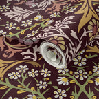 Close-up of William Morris Blackthorn wallpaper in maroon highlighting intricate floral details, vines, and classic Arts and Crafts pattern design.