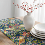 William Morris Strawberry Thief table runner featuring the iconic Arts and Crafts bird and botanical pattern, styled on a rustic wooden table for heritage revival and English country dining decor.