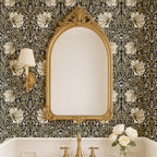 Bathroom with ornate mirror against William Morris Pimpernel wallpaper in Sage & Cream on Ebony.